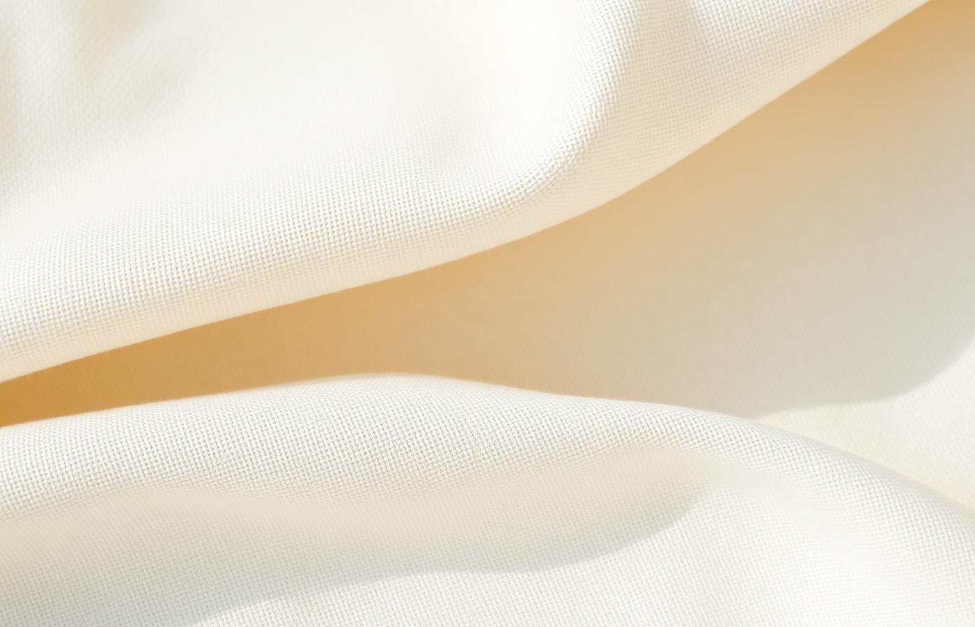 Soft cream linen fabric in gentle light
